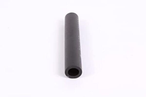 A black tube is sitting on top of the floor.