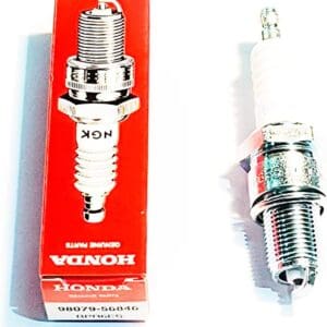 A box and some spark plugs are sitting next to each other.