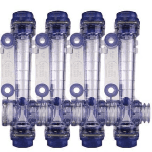 A group of four pipes with blue caps.